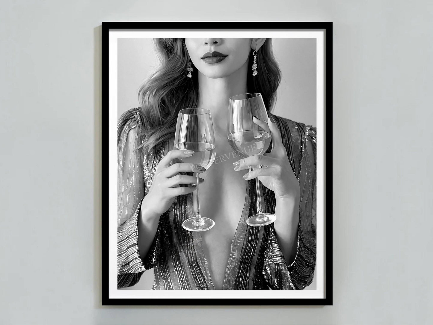 Framed artwork of a woman holding two wine glasses against a plain background