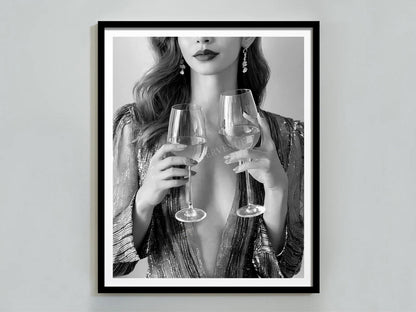 Framed artwork of a woman holding two wine glasses against a plain background