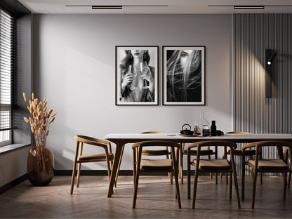 Dining room with wooden table and chairs, black and white wall art, and decorative elements.