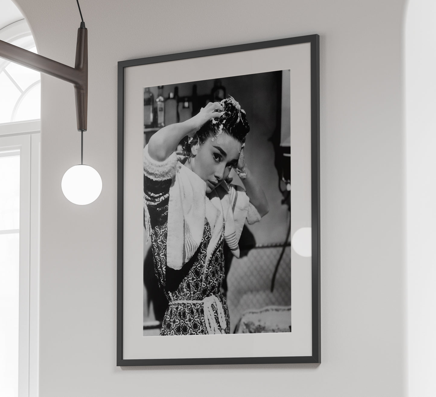 Stylish black and white Audrey Hepburn print washing her hair, blending vintage photography with classic Old Hollywood charm. Perfect bathroom wall art, available as a digital download.