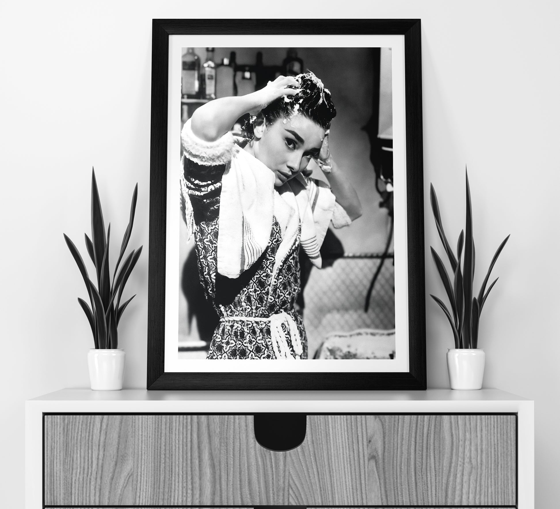 Stylish black and white Audrey Hepburn print washing her hair, blending vintage photography with classic Old Hollywood charm. Perfect bathroom wall art, available as a digital download.