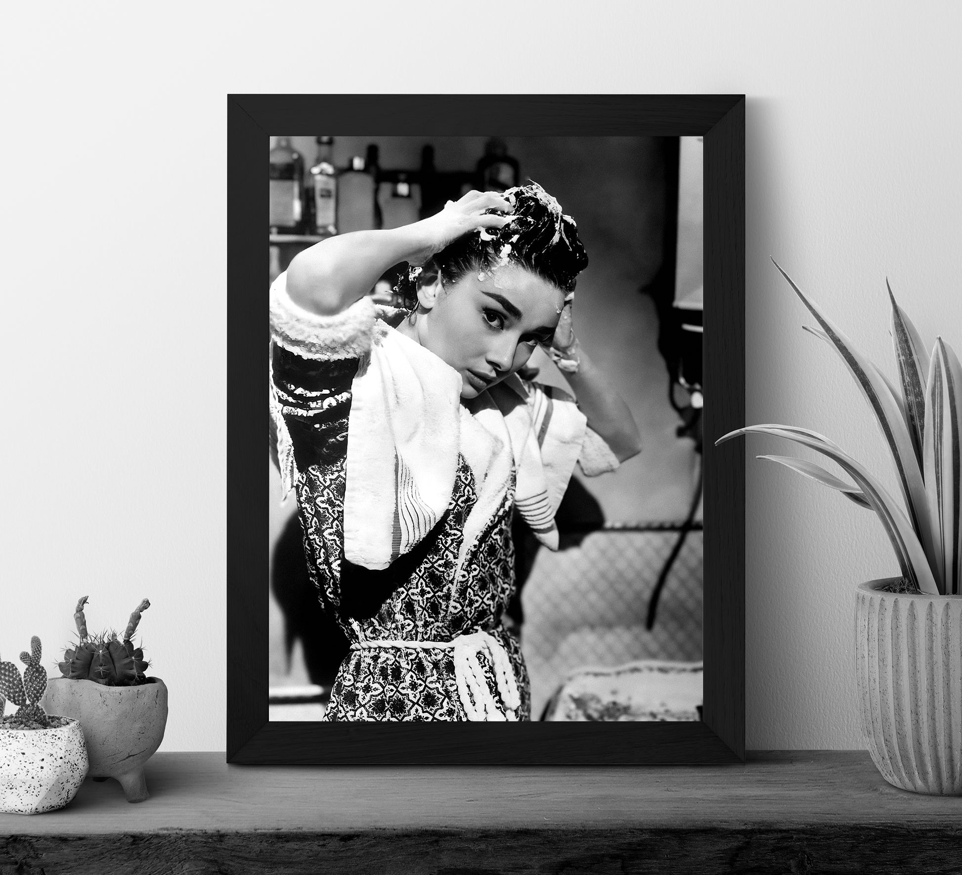 Stylish black and white Audrey Hepburn print washing her hair, blending vintage photography with classic Old Hollywood charm. Perfect bathroom wall art, available as a digital download.